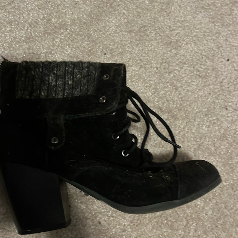 Black lace up, high heeled boots. Size 8.5